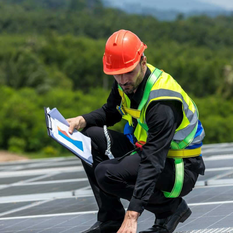 Engineer working setup Solar panel at the roof top. Engineer or worker work on solar panels or solar